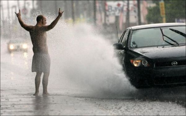 misc-man-getting-splashed-by-car